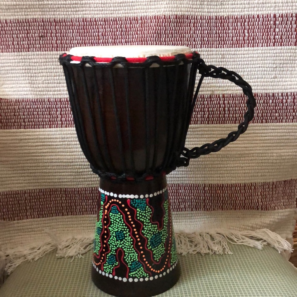 Wood hand painted hand drum.